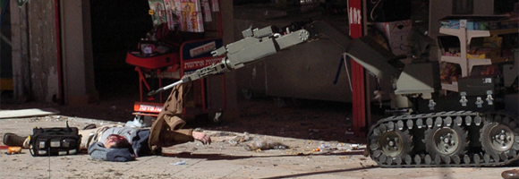 A bomb disposal robot at Dimona in Israel taking the jacket off a dead man Photo by Haim Horenstein