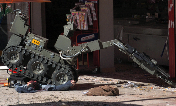 A bomb disposal robot at Dimona in Israel running over the corpse of a dead man Photo by Haim Horenstein