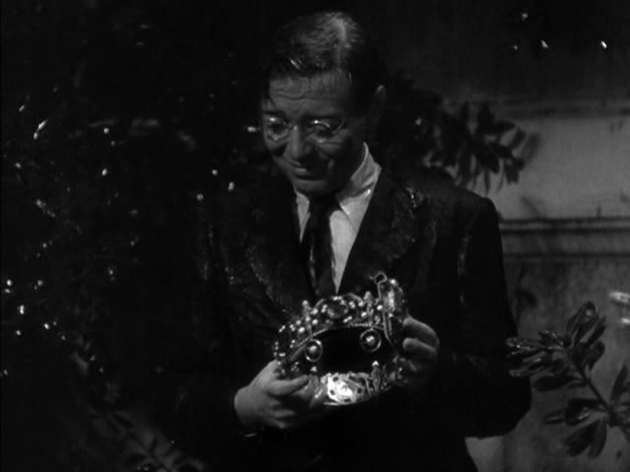 Mr. Moto (Peter Lorre) with the crown of Bilqis, Queen of Sheba, in 'Mr. Moto takes a Vacation' (Foster 1939)