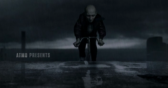 Roger cycling through the rain during the opening credits of 'Metropia' (Saleh 2009)